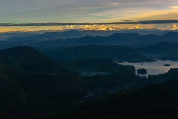 Fototapeta na wymiar Sunrise above the green valley.