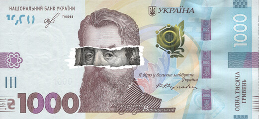 Ukrainian banknotes with 100 US dollars bill. Close up Ukrainian money and US banknotes. Ukrainian hryvnia