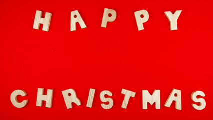 Happy christmas sentence made of wood letters.