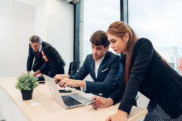 Successful business team working together in a co-working office	