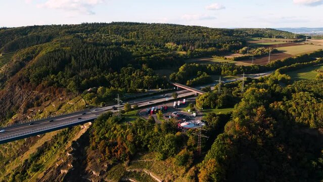 Moselle Viaduct, Winningen, Germany - aerial drone flyover the Mosel Valley West rest stop at Autobahn A61 over the river Moselle valley, bridge connecting the Eifel mountains since 1972 - bird view