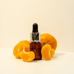 A bottle of essential oil, Aromatic tangerine oil in a dark bubble, cosmetic oil from tangerine....
