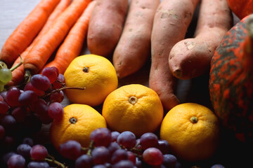 Various healthy autumnal food on wooden table. Selective focus.