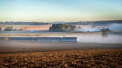 a train passing through an autumn landscape