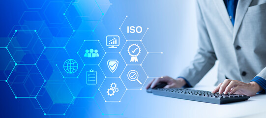 ISO Certification of standards quality control assurance business technology concept. Businessman using virtual screen iso certification icon to guarantee.