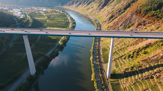Moselle Viaduct, Winningen, Germany - aerial drone flyover the Autobahn A61 at Moseltalbr&uuml;cke - cars driving over the river valley Moselle on a high bridge connecting the Eifel mountains since 1972