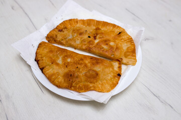 Pies with cabbage and onions. Fried pies. Chebureks.