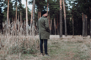 man walking in forest