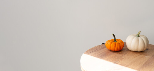 pumpkins on a wooden table close-up with a blurred background.