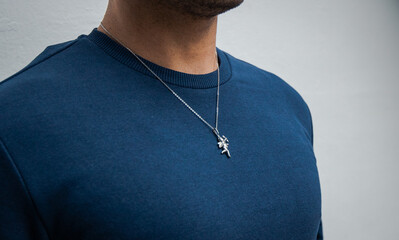 Silver necklace on blue background jewelry fashion 