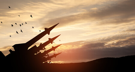 The missiles are aimed to the sky at sunset. Nuclear bomb, chemical weapons, missile defense, a system of salvo fire.
