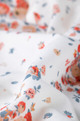 Fashionable floral cloth, ondulate modern textile close up view