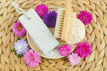 Fototapeta na wymiar Pumice stone and wooden massage body brush. Eco friendly toiletries set. Natural beauty treatment, skin care or homemade pedicure concept. Top view, copy space.