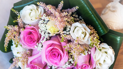 Close-up with the bouquet of roses for the bride and bridesmaids