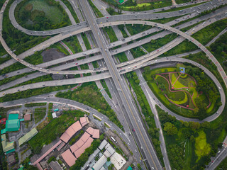 Aerial view city transport junction cross road with green public park transport industry