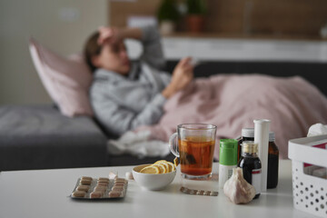 Table full of medicines for cold and flu