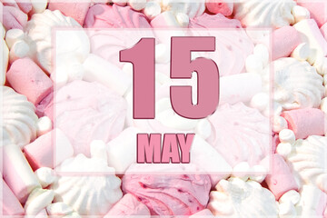 calendar date on the background of white and pink marshmallows. May 15 is the fifteenth day of the month