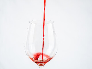A glass of wine on a white background.