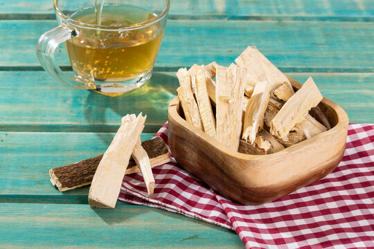 Quassia Amara - Stems Of Quassia Medicinal plant; On Wood Background
