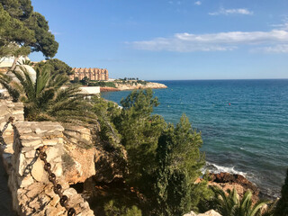 Salou, Spain, June 2019 - A view of a large rock next to water