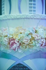 Elegant cake for wedding celebration, decorated with various items