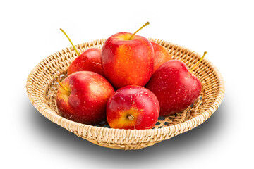 Pile of fresh ripe crisp snack-size mini apples or little apples or small apples in bamboo tray on white background with clipping path.