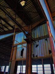 Abandoned factory building with broken glass, urban exploration dream