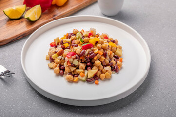Overnight soaked legume salad of chickpea-kidney beans and other raw veggies mixed with herbs and mild spices