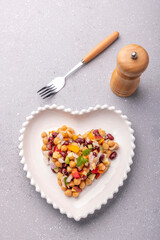 Overnight soaked legume salad of chickpea-kidney beans and other raw veggies mixed with herbs and mild spices