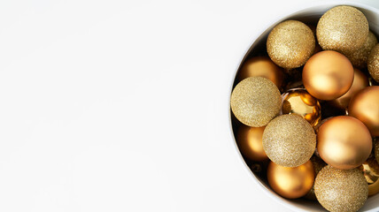a cone full of golden Christmas balls with white background and space for copying