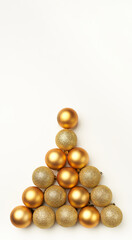 golden christmas balls with fir tree triangle shape on a white background with space for copy