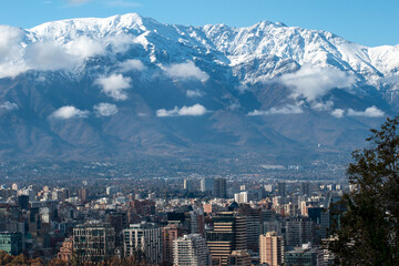 Fototapeta premium view on a city with snowy mountains
