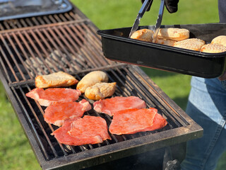 Placing meat on the barbeque