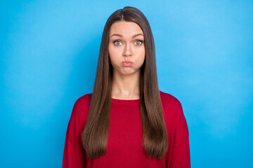 Photo of young impressed long hairdo lady hold air wear red sweater isolated on blue color...