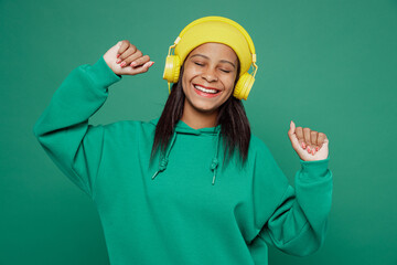 Little happy kid teen girl of African American ethnicity 13-14 years old wear casual hoody hat...