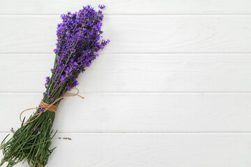 Dry lavender flowers on wooden background close up