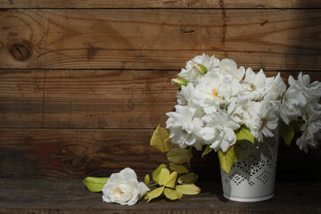 bouquet of white roses on the wooden background with copy space
