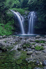 Beautiful view of twin waterfalls in the forest, Batu Blek Waterfall, Tasikmalaya, West Java, Indonesia