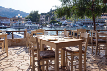 Fototapeta na wymiar empty waterfront cafe and serving tables