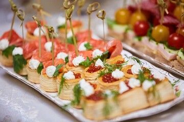 Delicious fish caviar canapes. Seafood in the diet. Decoration of the festive table.