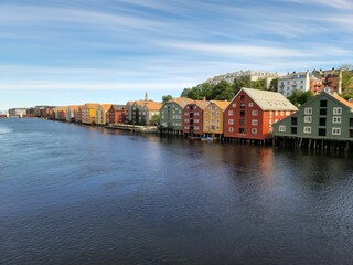 Beautiful shot of colorful houses on the shore of River Nidelva in Trondheim, Norway