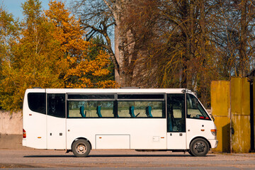 Fototapeta na wymiar Empty tour bus parked outdoors