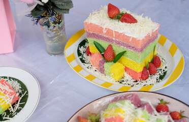 Rainbow Swirl Cake. Square rainbow cake on a plate