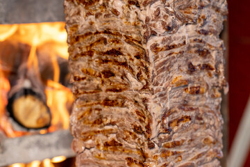 Turkish meat doner. Meat cooked in wood fire is doner. Traditional Turkish cuisine delicacies. Close up