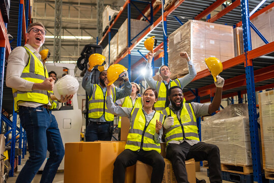 Professional Warehouse Worker Team Celebrating Success In Warehouse Factory, Cheerful Workers Having Fun At Work, Happiness At Job, Concept Of Success, Happy Team Enjoying Their Successful Job