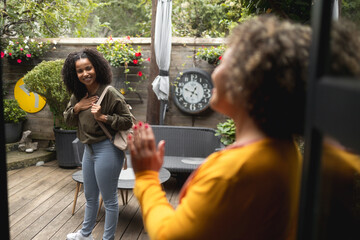 A teen African-American girl is leaving the psychotherapist's office after a successful session....
