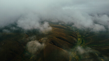 Cars are driving on the road in foggy weather - drone shots
