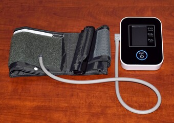 Sphygmomanometer medical device used for measuring blood pressure in patients. Directly above view,...