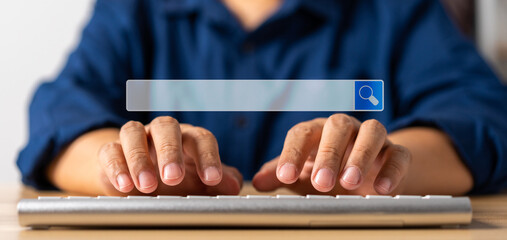Businessman using a keyboard and notebook for searching information on the internet, searching...