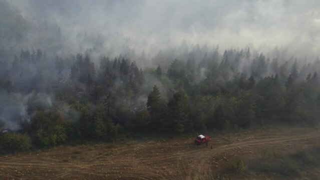A fire engine is trying to put out the fire in the forest - Fire in Borjomi
